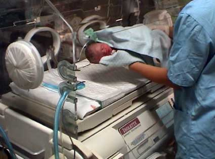 Nurses with Baby and Incubator