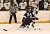 Gustavus' Ben Ollila skates past Kevin Rollwagen.