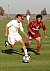 Midfielder Chris Pinahs dribbles past an Auggie defender.