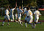 The Gustavus men's soccer team celebrates following a goal.