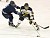 Junior John Arundel plays the puck just ahead of a Lawrence player.