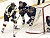 Sophomore Sami Idris looks to make a pass from behind the net.