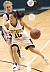 Senior Missy Mills drives toward the hoop from the perimeter.