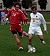 Midfielder Jeffrey Johnson plays the ball up the field.