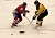 Gustavus junior forward Drew Keller passes the puck up the ice past a Saint John's defender in the Gusties 4-3 loss.