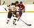 John Arundel carries the puck out of the Gustavus zone.
