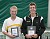 John Kauss and Andy Bryan displays their ITA singles trophies.
