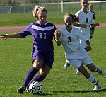 Kenzie Del Santro (#3) battles for position against a St. Thomas attacker.
