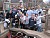 The team gathers for a photo after spending the day cleaning up a playground in Rushford, Minn.