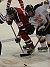 Brandon Buskowiak of Gustavus battles Mike Bry of St. Mary's for the puck on a face-off.