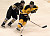  Spencer Campion of Gustavus skates past Bryan Osmundson of St. Olaf.