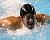 Swimmer pushes himself towards the wall.