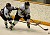 Mari Gunderson battles Elise Hedlund along the boards.