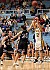 Jess Vadnais hits a three-pointer over Jessica Arechigo.