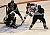 Matt Duncan, sophomore forward, tries to slip the puck past St. Olaf goaltender.