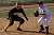 Gustavus runner leads off third base.