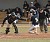 Catcher Shea Roehrkasse tags a Carleton runner out at the plate.