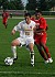 Fraser Horton shields the ball from a Cardinal defender.