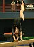 Christina Sorenson performs an element on the balance beam.