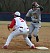 Mike DesLauriers hustles back to first base before the tag.  (Saint Mary's Sports Information)