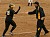 Jenna Johnson celebrates with Coach Annis after hitting a home run in the first game.