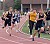 Carson Smith hands off the baton to Justin Lund in the 4x800 relay.