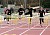 Kaelene Lundstrum and Aryn Bell push towards the finish line in the 110-meter hurdles.