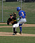 Tory Herman keeps his foot on first base as the throw just beats the Macalester runner.