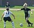 #11 Samantha Engh takes on Nebraska Wesleyan defender #13 Amy Chandler.