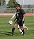 #4 Jeff Aasness settles the ball with pressure from the Nebraska Wesleyan defender.