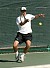 Singles champion Ben Lundell unloads on a forehand.