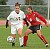 #17 Gwen Petersen looks dribbles up field.