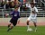 Gustavus midfielder #20 Jon Astry dribbles up field.
