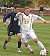 Gustavus defender #23 Grant Morlock dribbles up field against Bethel earlier this year.