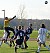 Gustavus goalkeeper Andy Moulton punches a Bethel cross away from the goal.