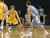 Andrew Olson puts defensive pressure on the Johnnie point guard.