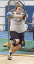 Junior Andy Klaers spins en route to a win in the weight throw.