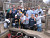 The team gathers for a photo after spending the day cleaning up a playground in Rushford, Minn.