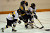 Christine Wicker and Jessica Doig battle for positioning to get to the puck.