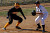 Gustavus runner leads off third base.