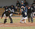 Catcher Shea Roehrkasse tags a Carleton runner out at the plate.