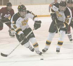 Ben Ollila and Steven Jensen skate into the Hamline zone.