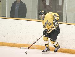 Andrea Peterson shown here with the puck on the boards scored two goals in the 6-0 win over the Cobbers.