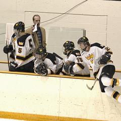 Head Coach Brett Petersen calls out for a line change.