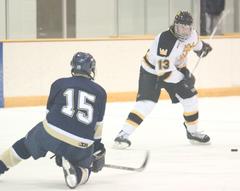 Gustie defenseman Keith Detlefsen winds up for the slap shot.