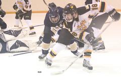 # 18 Adam Meyer holds off the Bethel defender.