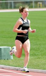 Nichole Petersen finished first in the 10,000 meters with a school record time of 36:48.52
