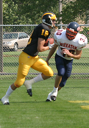 Wide receiver Tom Johnson scampers into the end zone for a touchdown just before halftime.