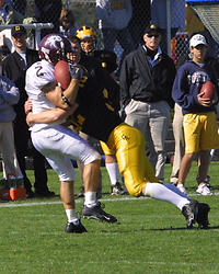 Gustavus' Wade Vrieze upends Augsburg's Ricky Schreier.