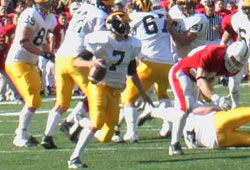 Sean Smith rolls out to his right in the third quarter against St. John's